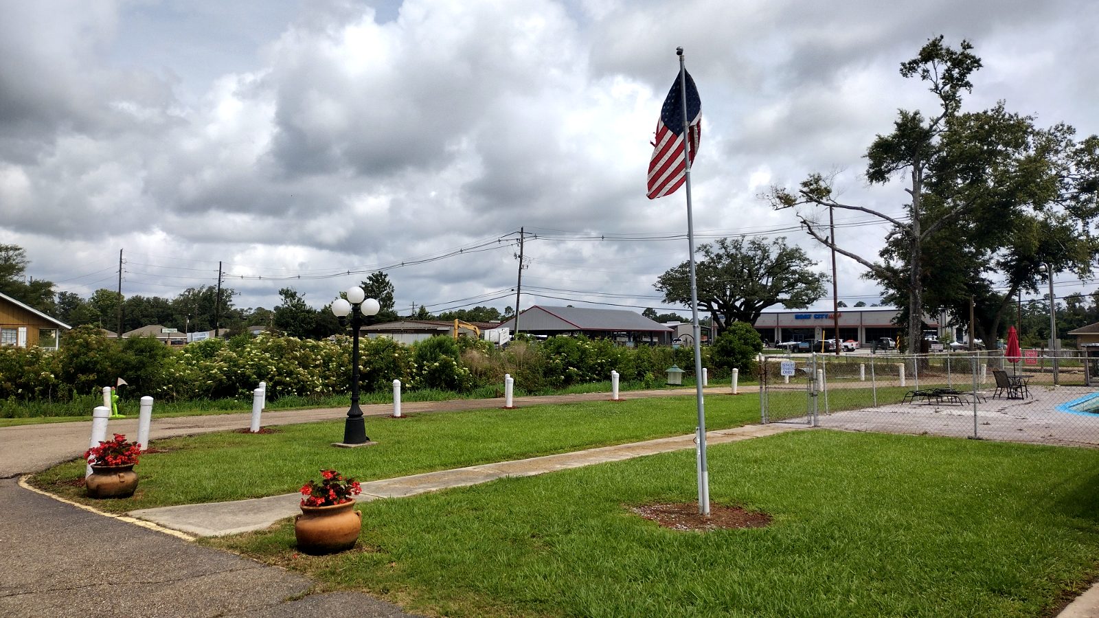 The flag-lined walkway at Singh RV Campground